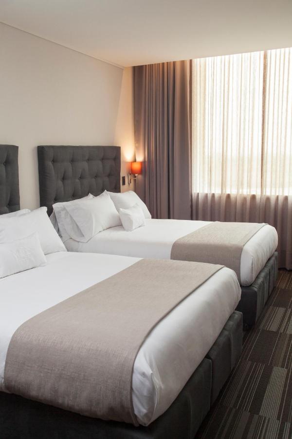 Mds Hotel Chillan Ngoại thất bức ảnh A room at the hotel